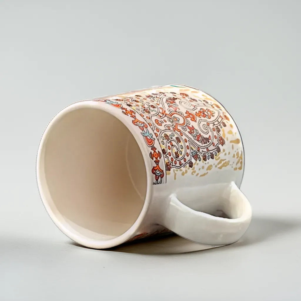 Golden Paisley Coffee Mug with Orange Accents